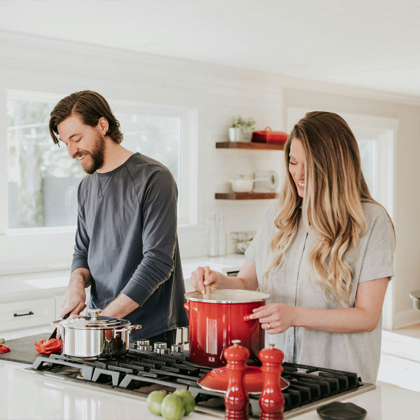A couple having a discussion in a kitchen